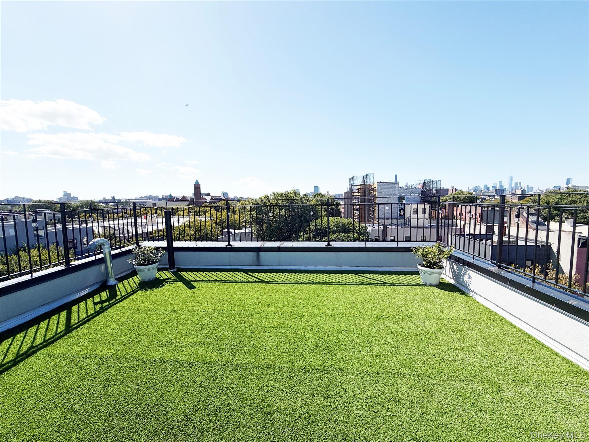 333 Tompkins Avenue, Unit PH2 Brooklyn, NY 11216 - Photo 2 of 33 a view of a swimming pool with a lawn chairs