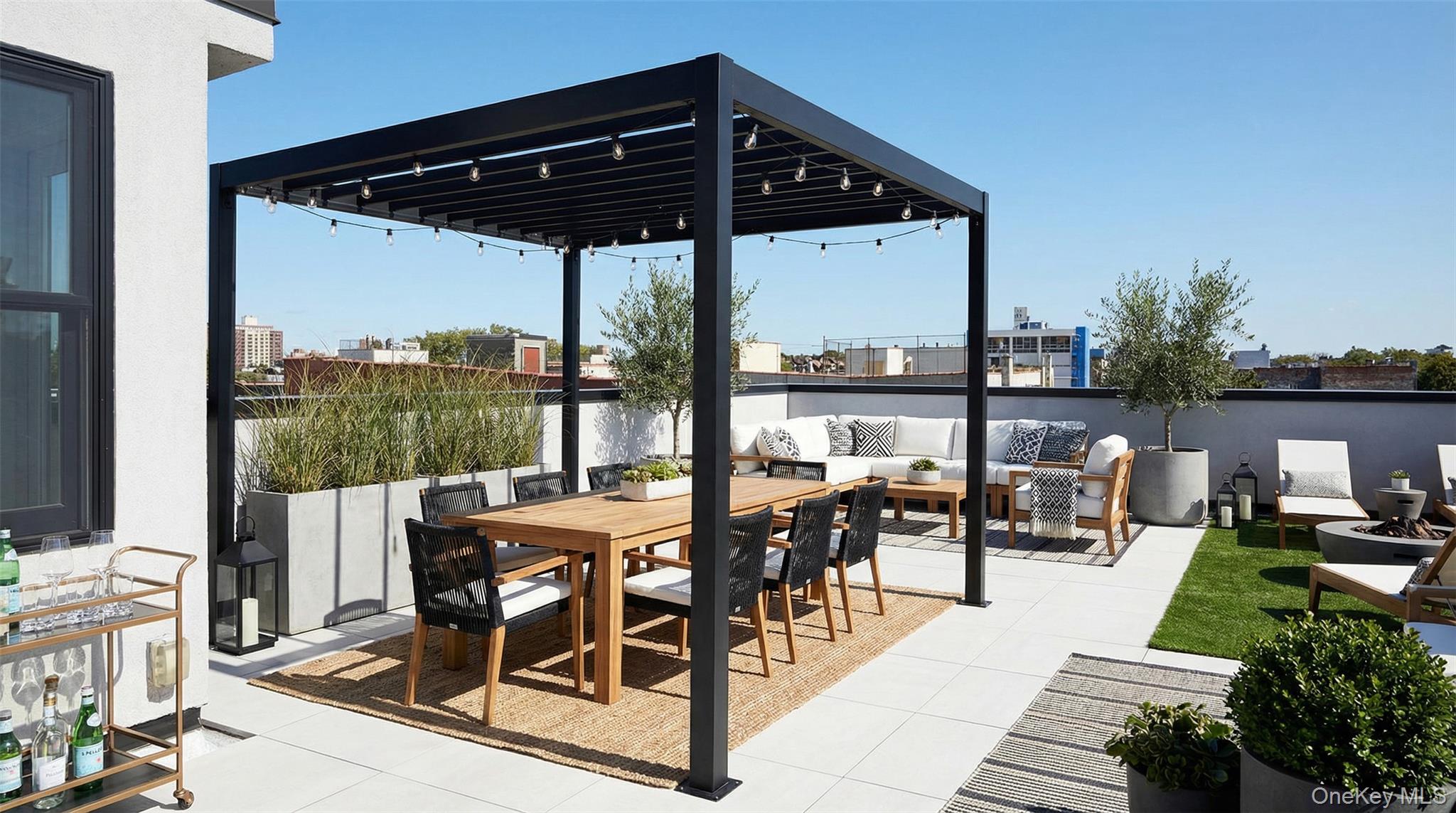 333 Tompkins Avenue, Unit PH2 Brooklyn, NY 11216 - Photo 3 of 33 a view of a patio with table and chairs potted plants with wooden floor