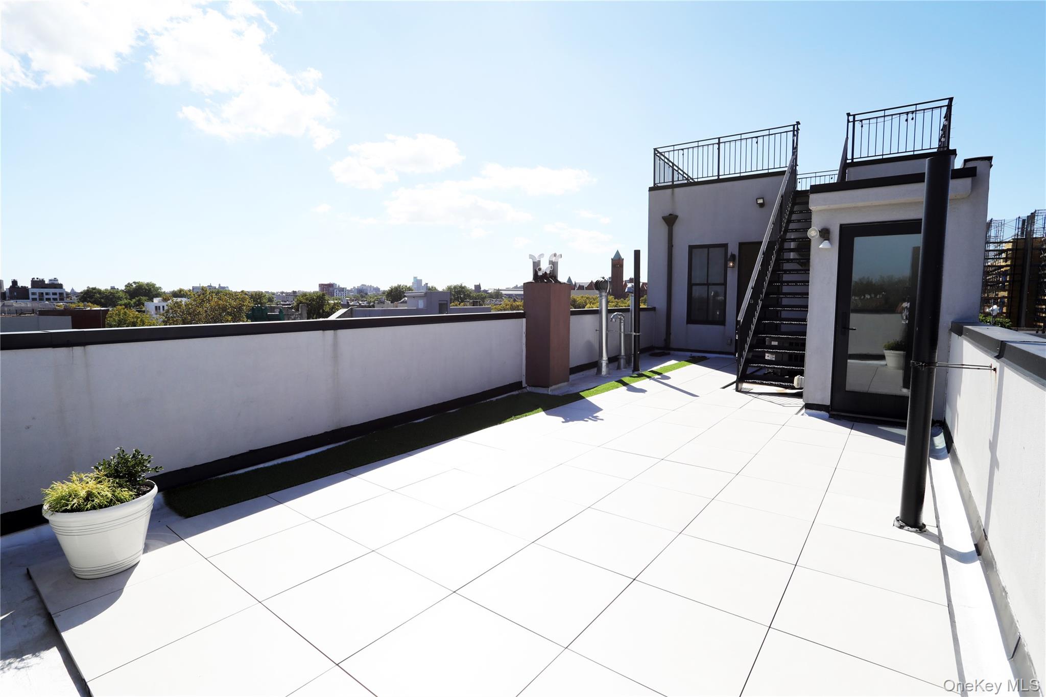 333 Tompkins Avenue, Unit PH2 Brooklyn, NY 11216 - Photo 5 of 33 a view of a terrace with chairs