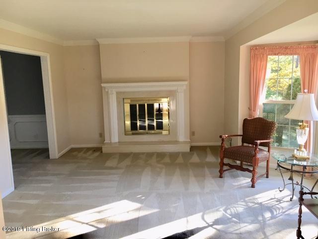 7811 Crown Top Road Louisville, KY 40241 - Photo 2 of 32 Living Room has hardwood floors under the carpet and features one of the two fireplaces in the home