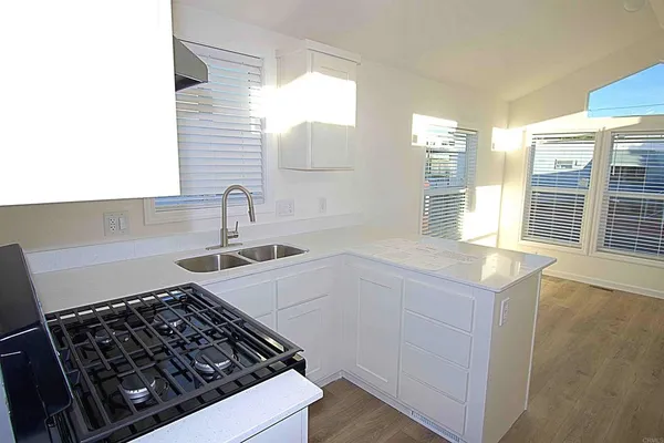 a kitchen with a stove and a sink