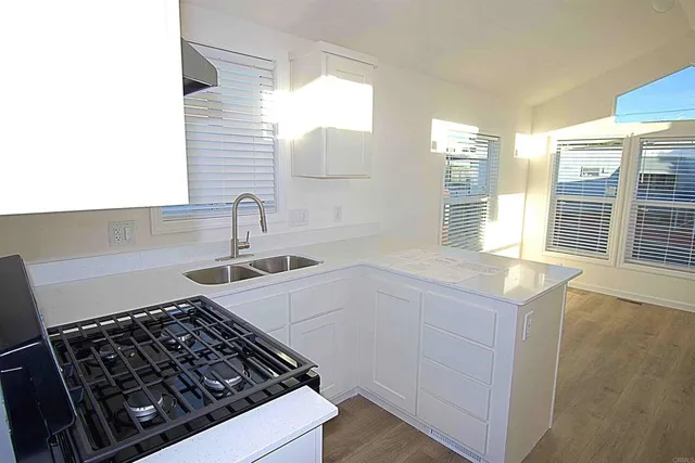 a kitchen with a stove and a sink