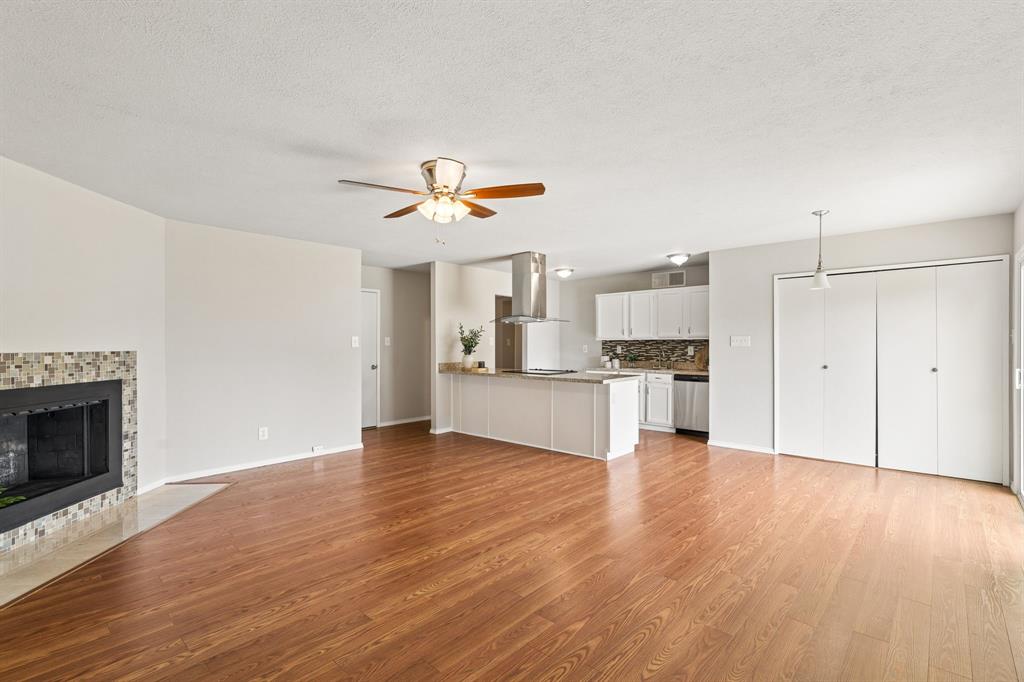 5620 Perrin Street The Colony, TX 75056 - Photo 5 of 31 a view of a kitchen with a sink and a stove top oven