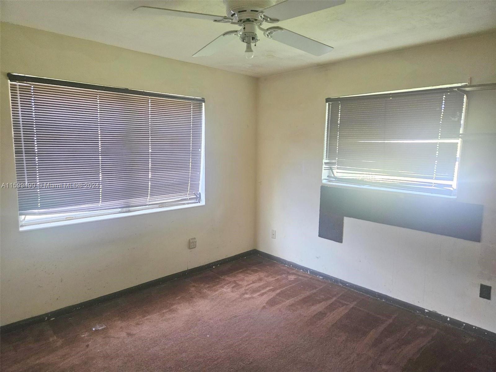 10470 Southwest 93rd Street Miami, FL 33176 - Photo 12 of 14 an empty room with a window