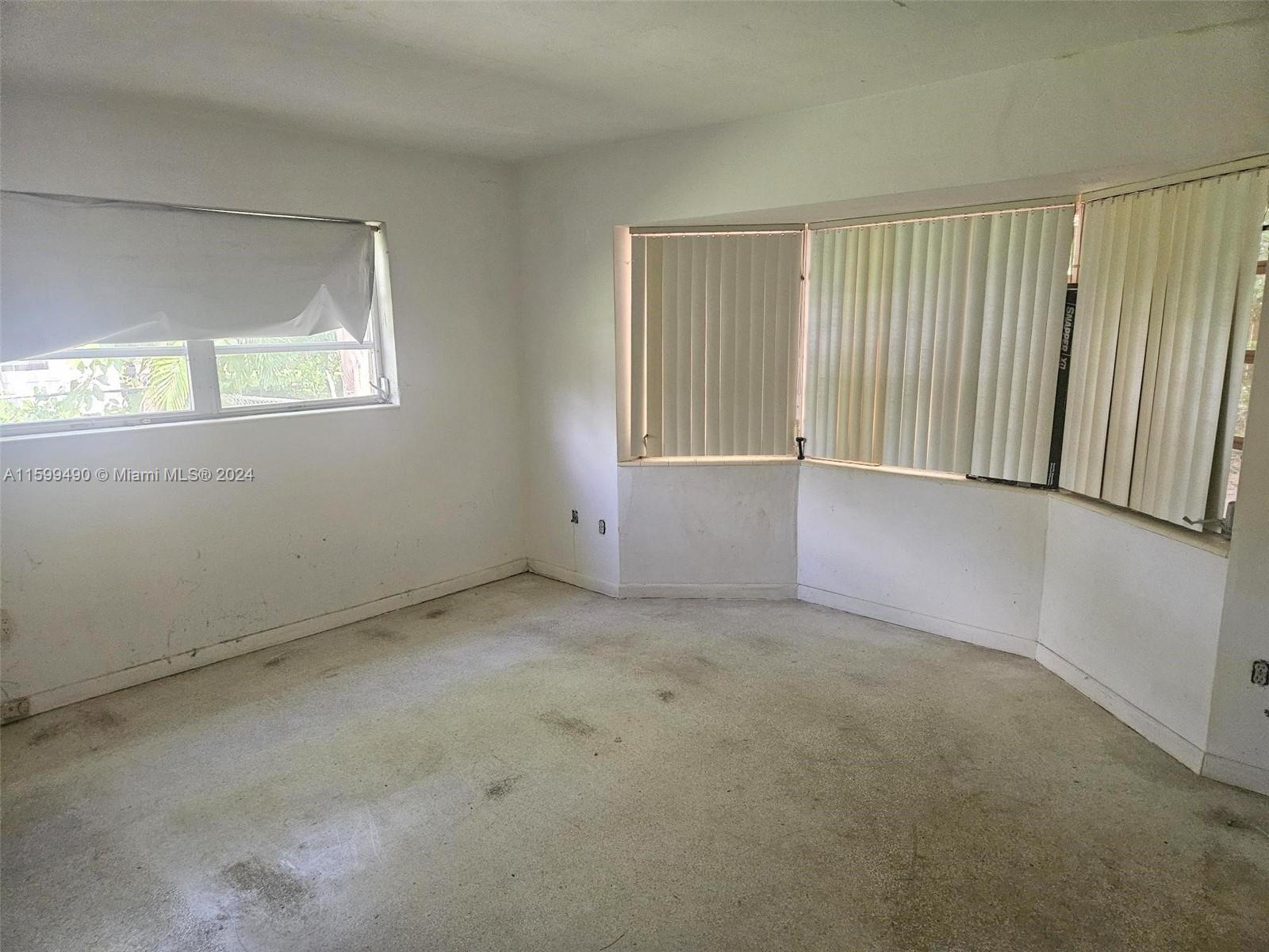 10470 Southwest 93rd Street Miami, FL 33176 - Photo 14 of 14 an empty room with windows