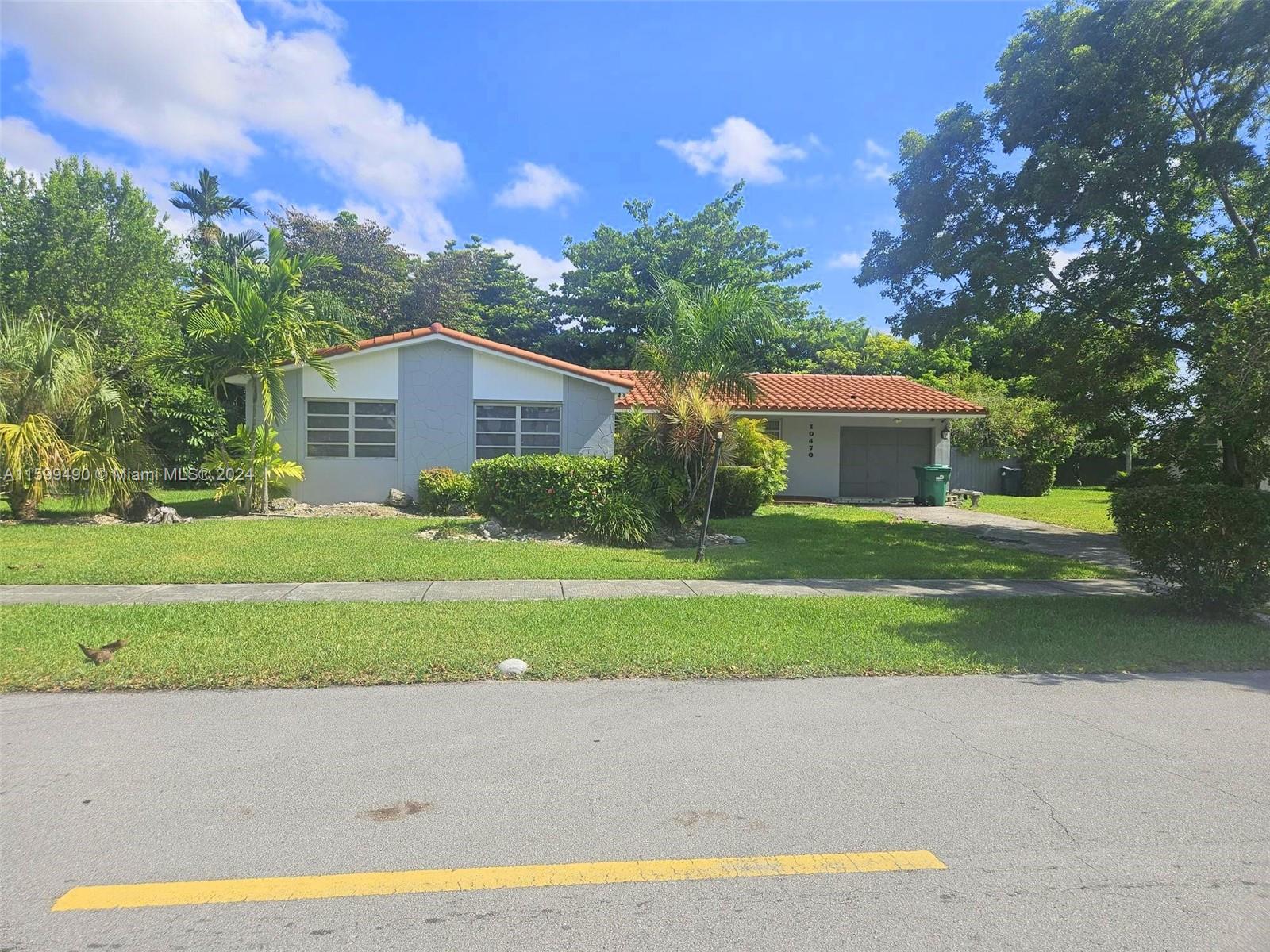 10470 Southwest 93rd Street Miami, FL 33176 - Photo 2 of 14 a view of house with outdoor space and yard