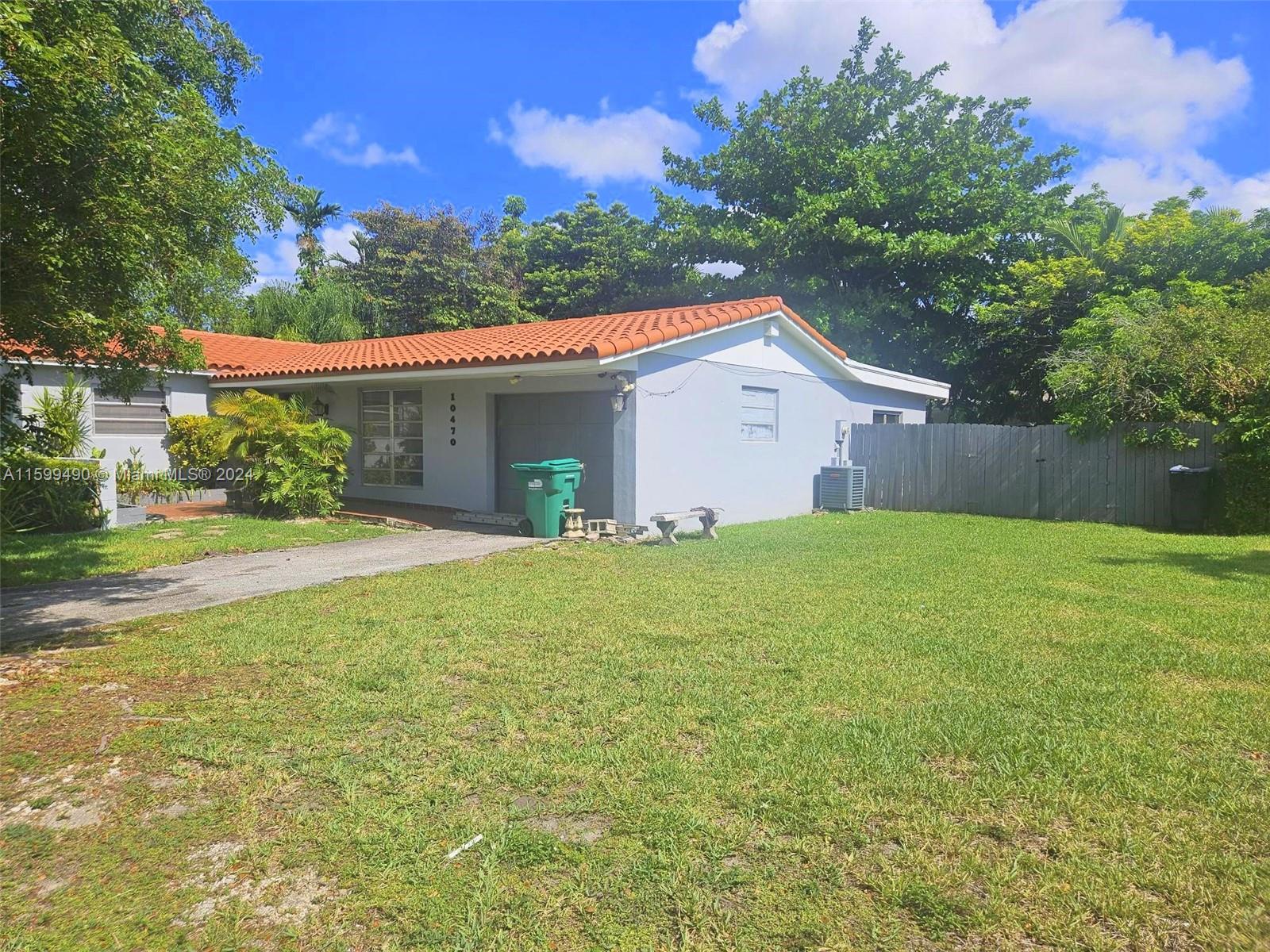 10470 Southwest 93rd Street Miami, FL 33176 - Photo 4 of 14 a front view of house with yard and green space