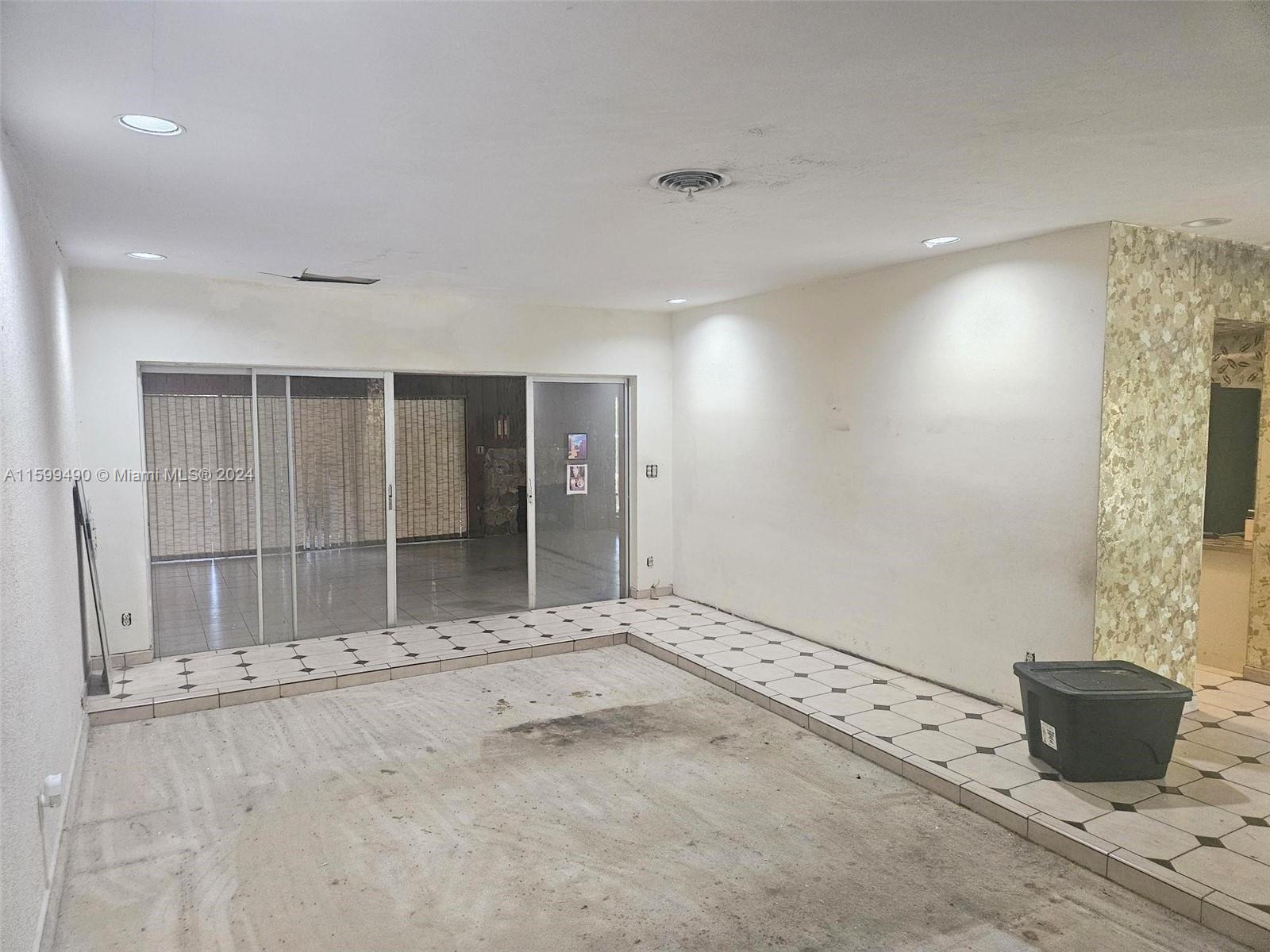 10470 Southwest 93rd Street Miami, FL 33176 - Photo 6 of 14 an empty room with windows