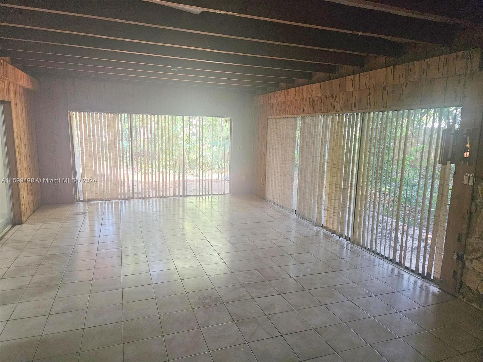 10470 Southwest 93rd Street Miami, FL 33176 - Photo 9 of 14 a view of an empty room with a window