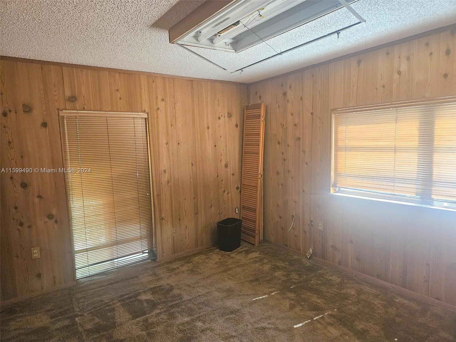10470 Southwest 93rd Street Miami, FL 33176 - Photo 10 of 14 a view of an empty room with a window
