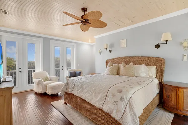 a view of a balcony with wooden floor and fence