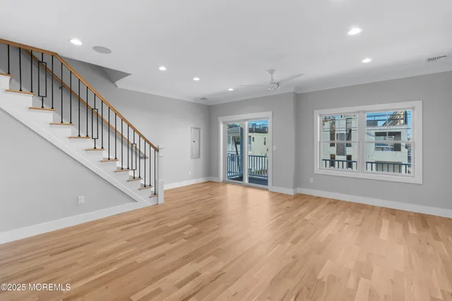 a view of an entryway with wooden floor