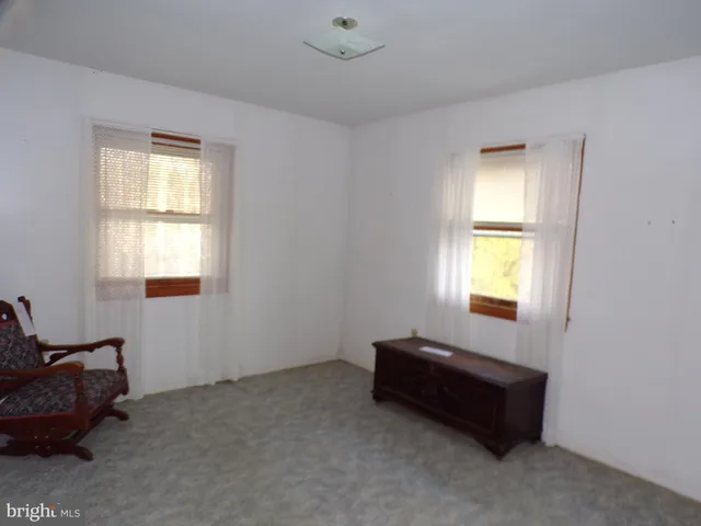 a room with furniture and a window