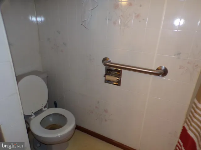 a bathroom with a toilet and a sink