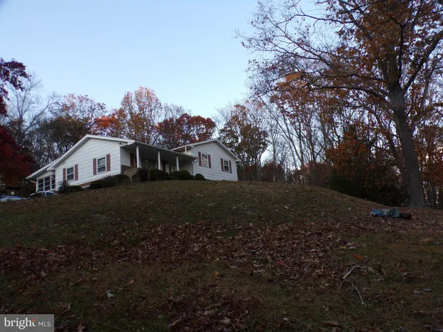 a view of house with outdoor space