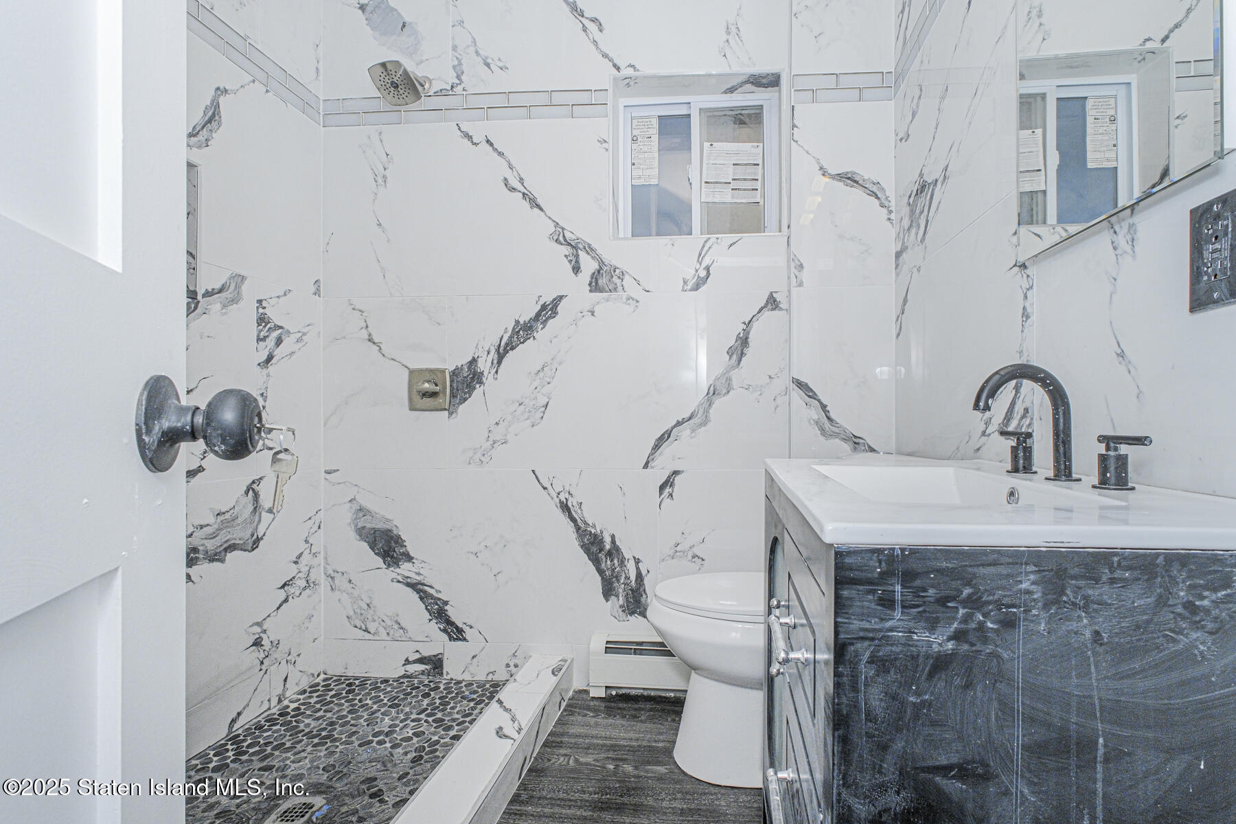 71 Sands Street Staten Island, NY 10304 - Photo 12 of 35 a bathroom with a shower and a sink