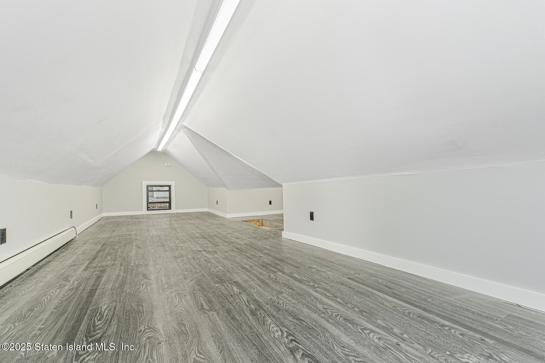 71 Sands Street Staten Island, NY 10304 - Photo 22 of 35 a view of empty room with wooden floor