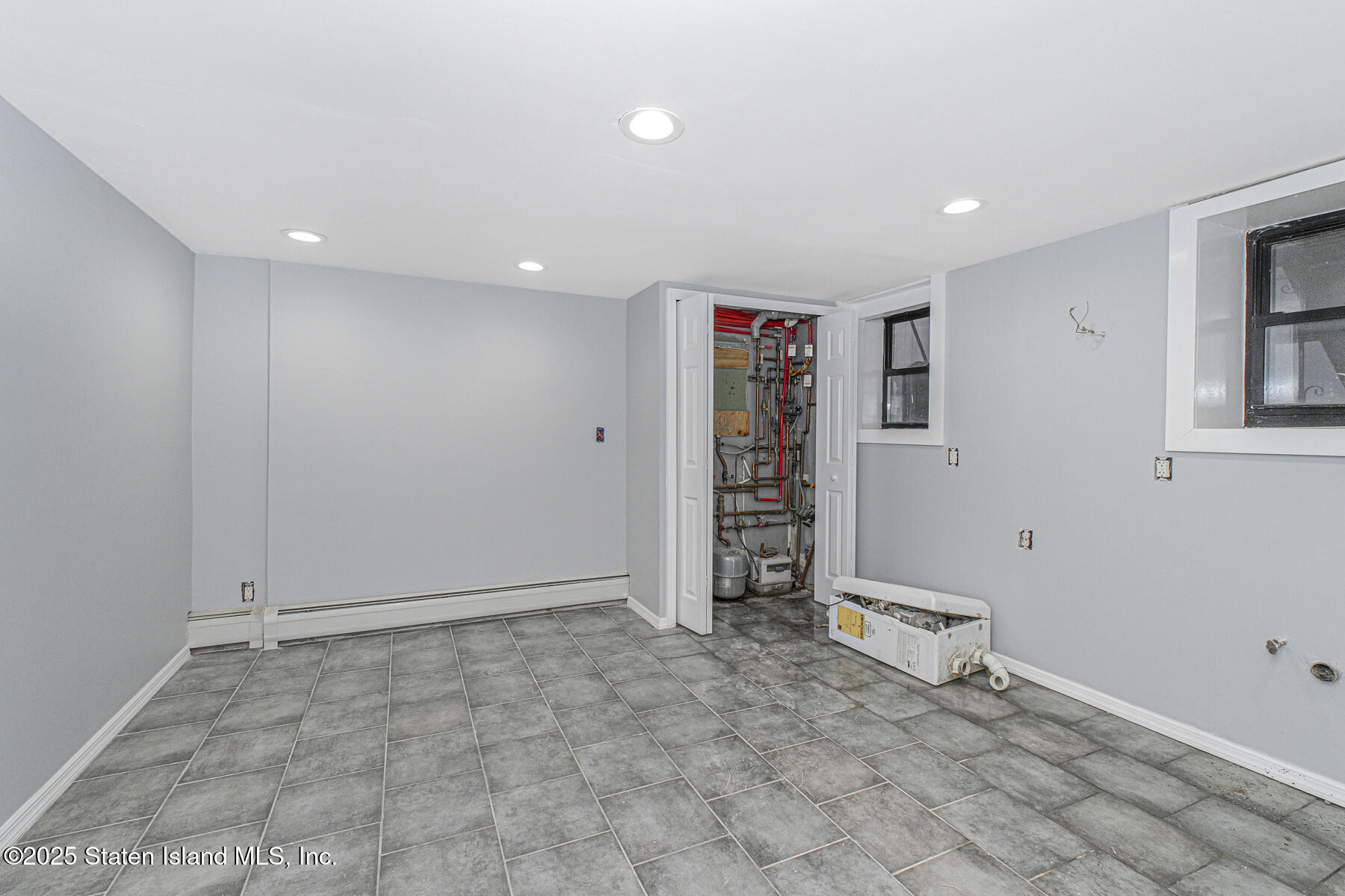 71 Sands Street Staten Island, NY 10304 - Photo 28 of 35 a view of an empty room with a fireplace
