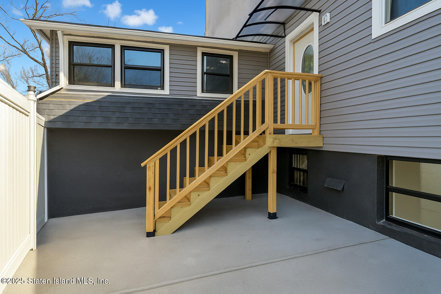 71 Sands Street Staten Island, NY 10304 - Photo 33 of 35 a view of a house with a wooden deck