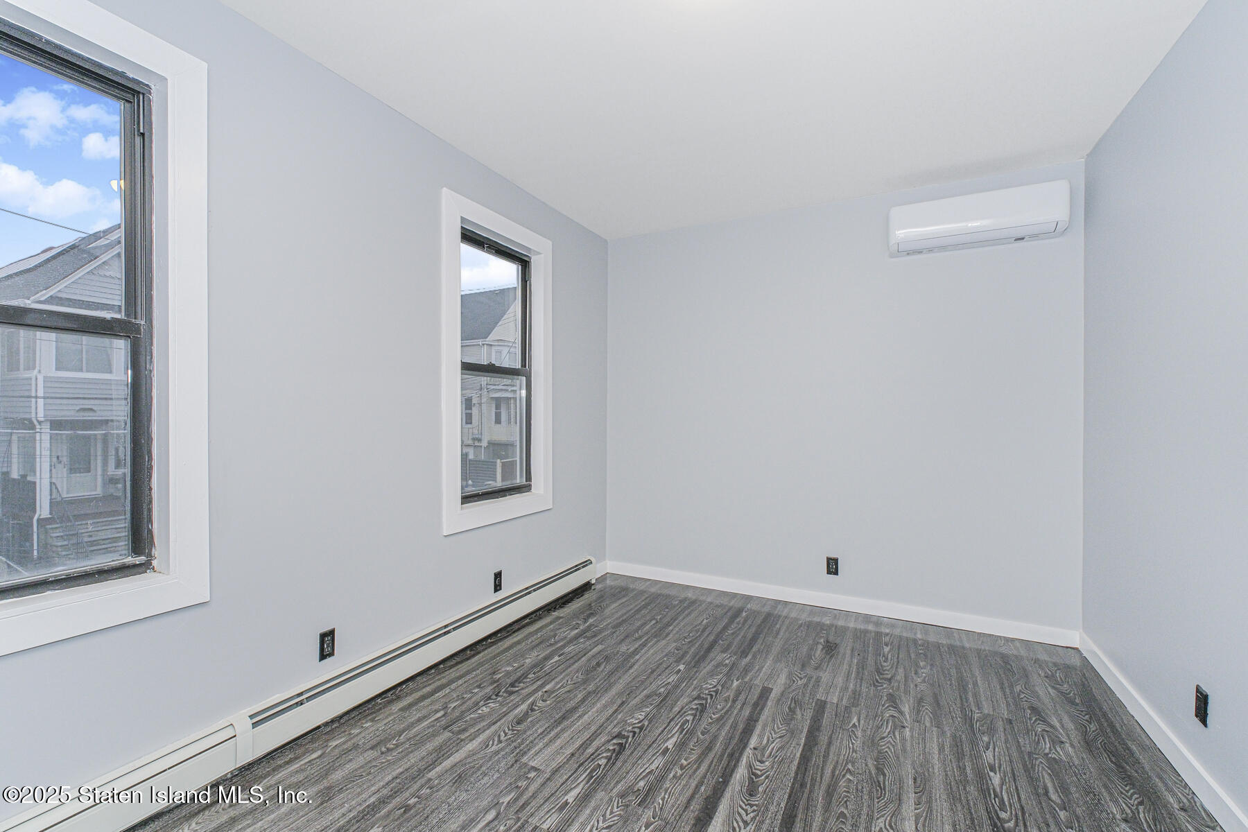 71 Sands Street Staten Island, NY 10304 - Photo 5 of 35 a view of a room with wooden floor and window