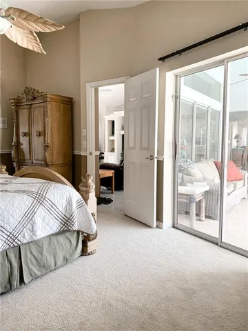 a bed room with a bed and a chair