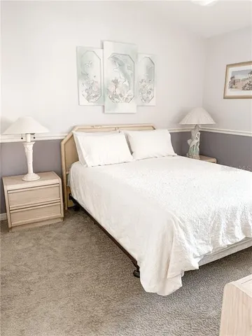 a bedroom with a bed and couch