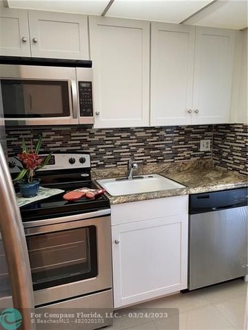 a kitchen with a stove and a microwave