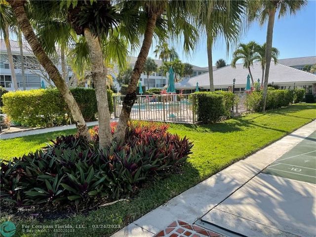 a view of a yard with a patio