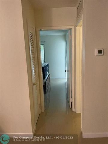 a view of a livingroom from a hallway