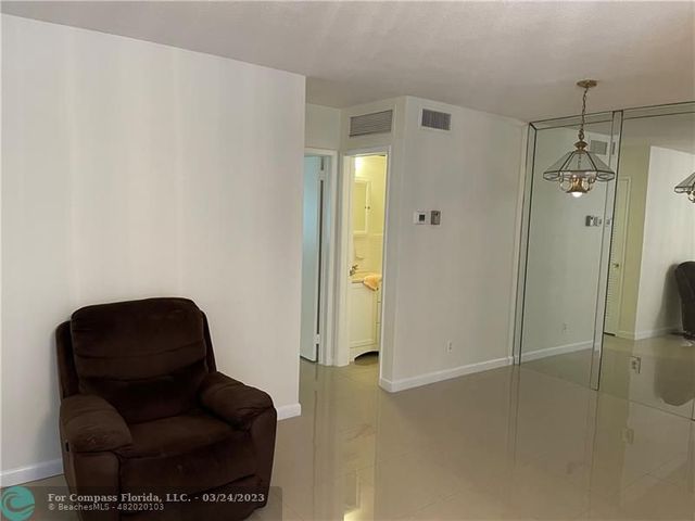 a living room with furniture and a shower