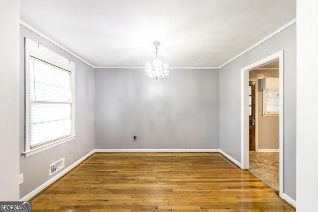 103 Thomas Street Dublin, GA 31021 - Photo 12 of 24 a view of empty room with window