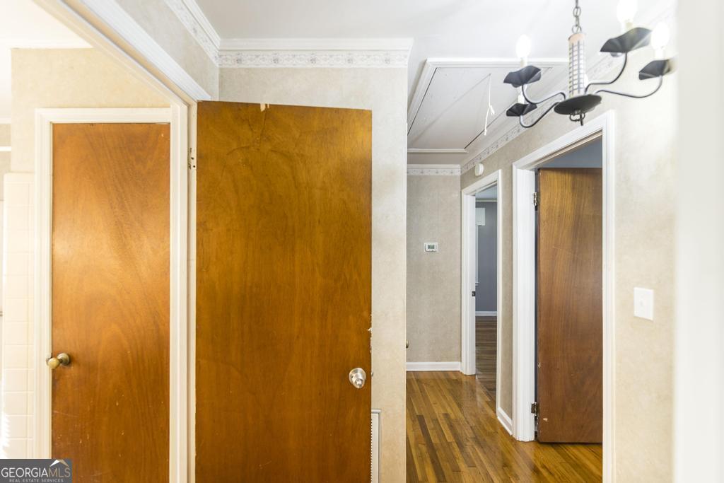103 Thomas Street Dublin, GA 31021 - Photo 19 of 24 a view of a bathroom with a shower and a mirror