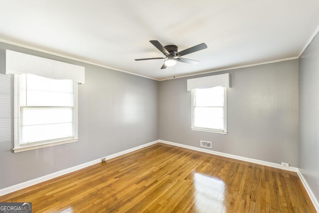 103 Thomas Street Dublin, GA 31021 - Photo 20 of 24 a view of a room with a window and a ceiling fan