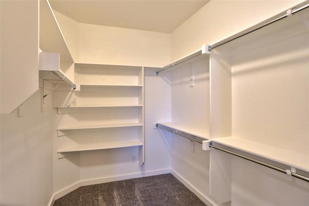 204 Pennington Road Josephine, TX 75173 - Photo 16 of 25 a view of walk in closet with empty racks