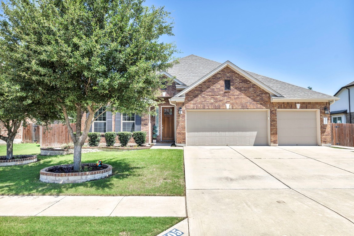 405 Clear Shadow Cove Cedar Park, TX 78613 - Photo 1 of 1 a front view of a house with a yard