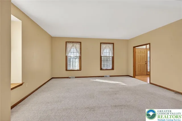 an empty room with windows