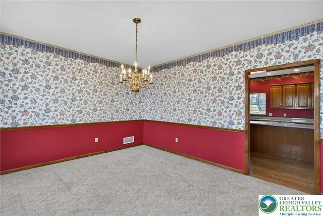 a room with a refrigerator and a stove