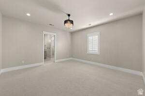 1141 East Lost Ridge Drive Washington, UT 84780 - Photo 102 of 108 Spacious room featuring neutral wall tones, recessed lighting, a decorative chandelier, white baseboards, and a window with plantation shutters