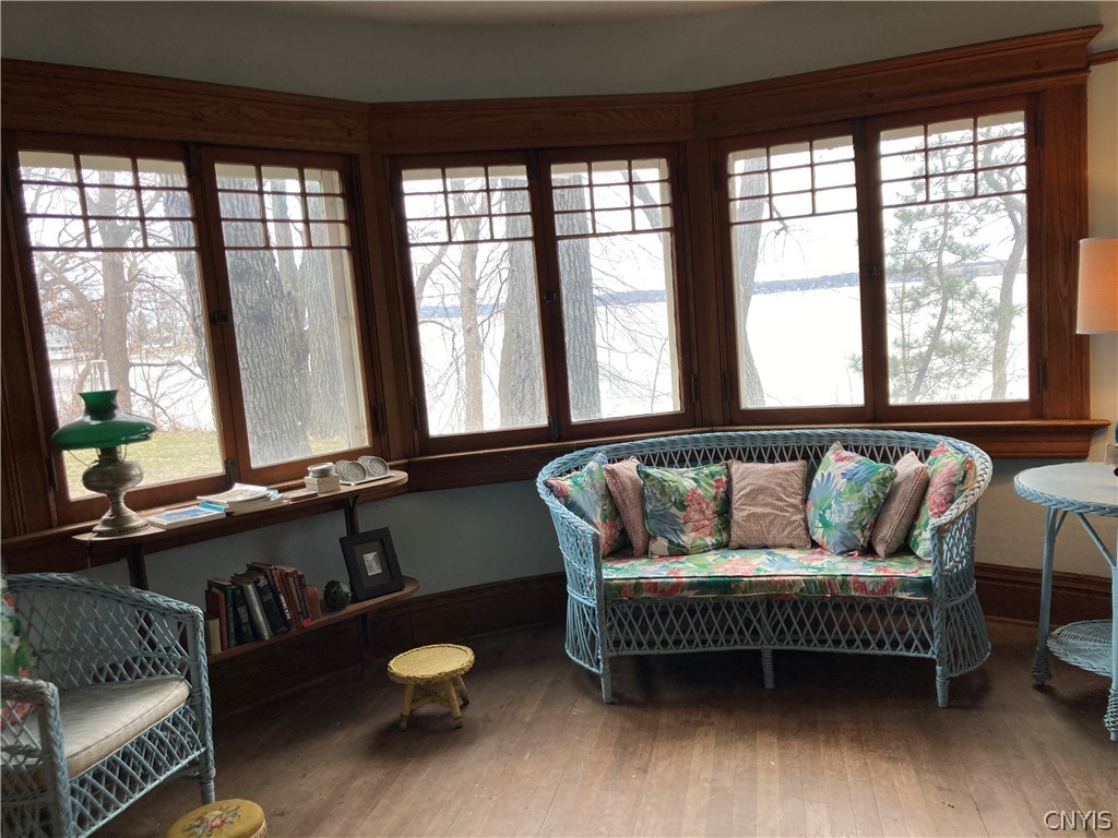 845 Farley's Point Road Springport, NY 13160 - Photo 13 of 45 South facing sitting room leads to lakeside porch.