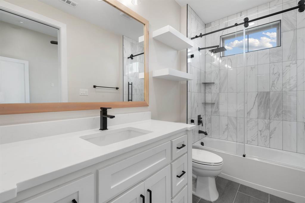 559 Aermotor Loop Weatherford, TX 76085 - Photo 22 of 39 a bathroom with a sink a toilet and a mirror