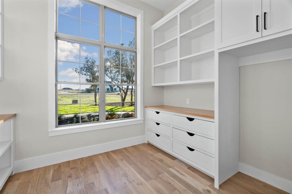 559 Aermotor Loop Weatherford, TX 76085 - Photo 23 of 39 a view of room with window and wooden floor
