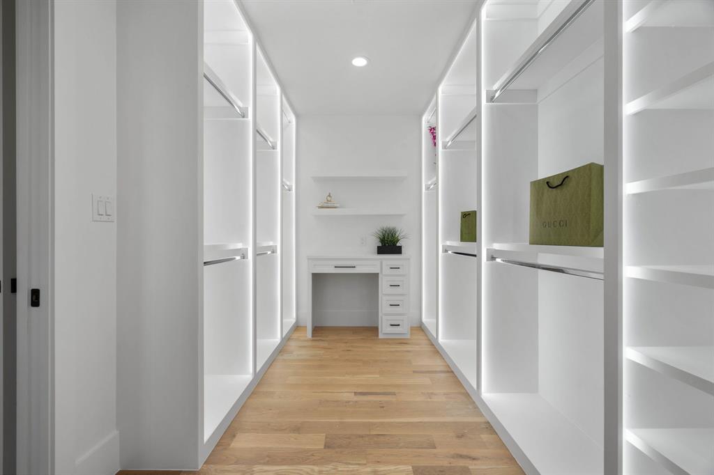 559 Aermotor Loop Weatherford, TX 76085 - Photo 27 of 39 a view of a hallway with wooden floor and cabinets