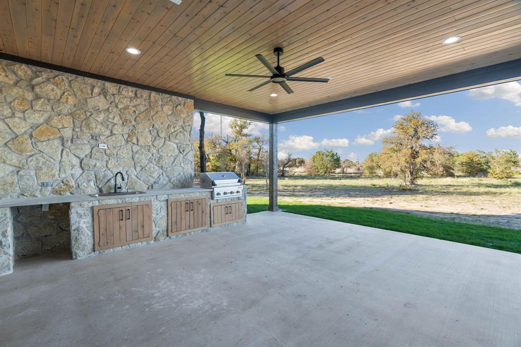 559 Aermotor Loop Weatherford, TX 76085 - Photo 36 of 39 a view of a kitchen with a sink and a large window