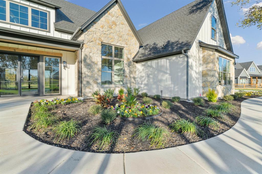 559 Aermotor Loop Weatherford, TX 76085 - Photo 5 of 39 a view of a house with a small garden