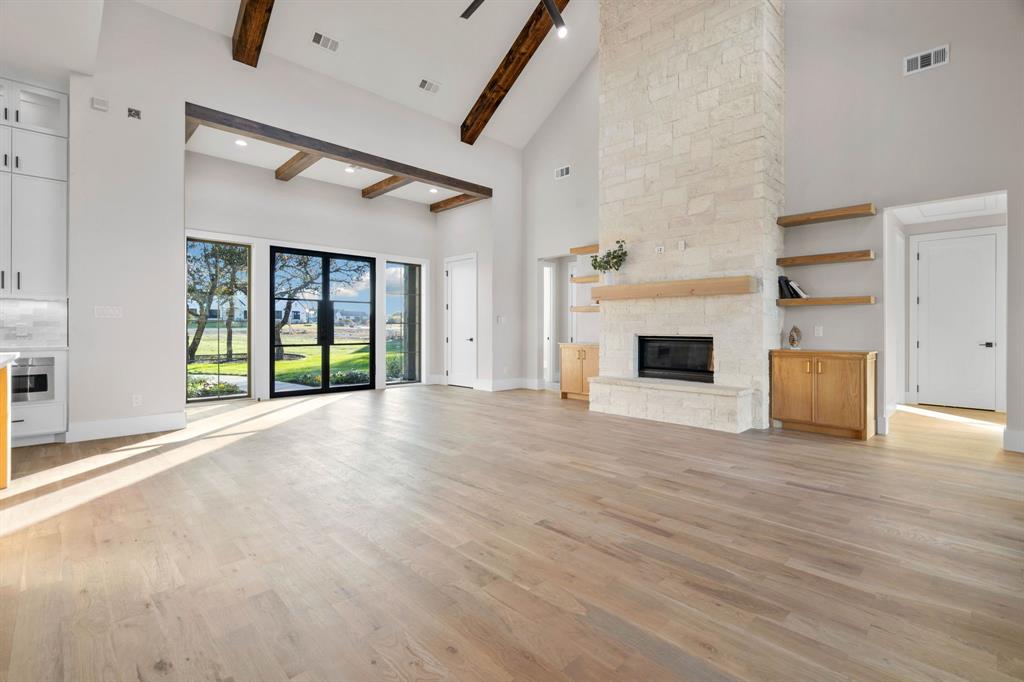 559 Aermotor Loop Weatherford, TX 76085 - Photo 8 of 39 an empty room with windows and fireplace