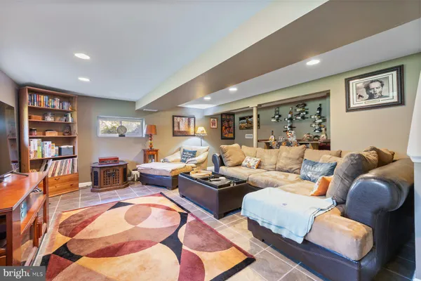 a living room with furniture or couch and a bookshelf