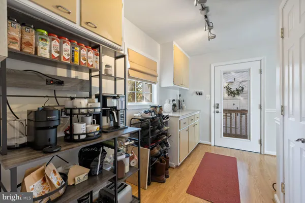 a open kitchen with lots of appliances and wooden cabinets