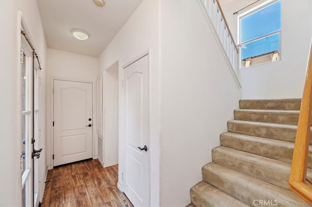 2454 Crossroads Court Duarte, CA 91010 - Photo 16 of 33 Direct access to garage, slider door to outdoor patio, and nice size storage closet underneath stairs.