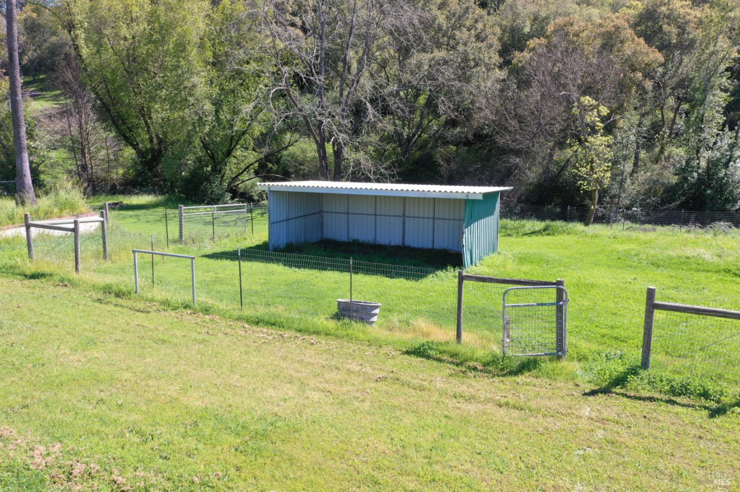 1360 Riebli Road Santa Rosa, CA 95404 - Photo 33 of 55 a backyard of a house with table and chairs