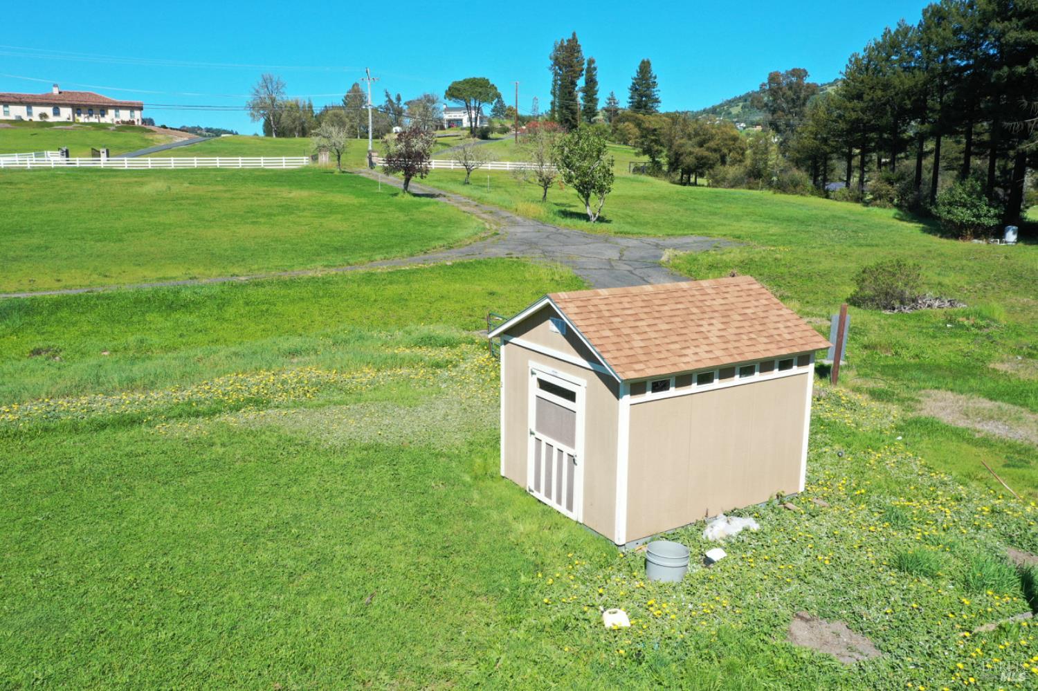 1360 Riebli Road Santa Rosa, CA 95404 - Photo 34 of 55 a aerial view of a house with a yard and trees